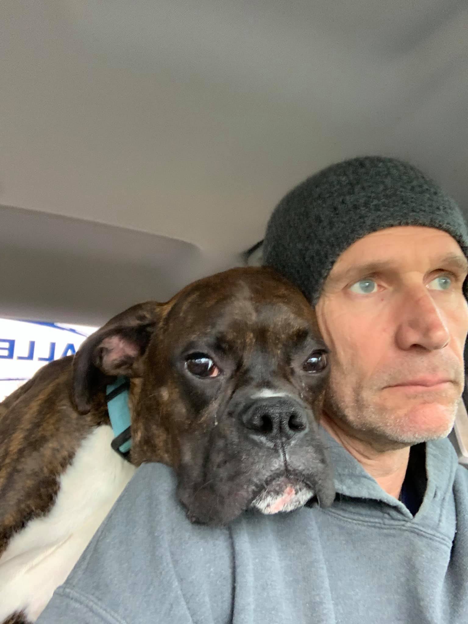Dan Derecskey, founder of Valley Painting Company, with his dog in his work vehicle